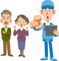 シニア夫婦と指を指す作業員の男性
