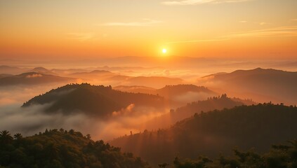 Obraz premium Majestic Mountain Range at Sunrise with Golden Hues and Misty Valleys.