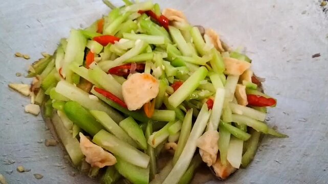 Video of stir fry chayote or tumis labu siam is a typical cuisine or Indonesian home dishes from Indonesia. Stir-fried chayote for lunch.