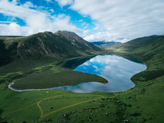 Aerial view of beautiful high altitude grassland mountain and lake landscape