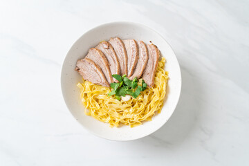 dried duck noodles in white bowl
