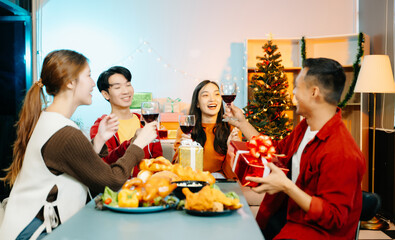 Group of Young Asian friend having, enjoy evening party together at home.