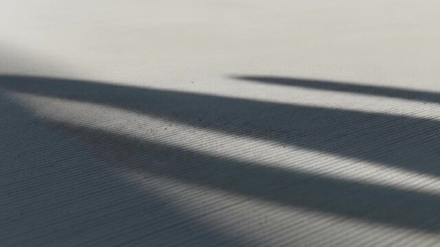 Abstract Close up of Ribbed Concrete Surface with Diagonal Shadow