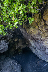 Sea Cave. Black Sand Beach, Waiʻānapanapa State Park.  Hana, Maui, Hawaii. Hana Volcanics / Lava flow.  Haleakalā / East Maui Volcano, is a shield volcano. Basalt

