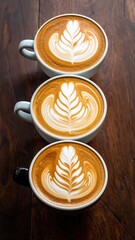 Three latte cups with leaf designs