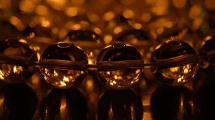 Shimmering Golden Ornaments Reflecting Festive Warm Bokeh Light Effects - Powered by Adobe