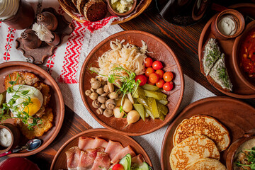 A colorful array of hearty dishes with pickled veggies and fresh ingredients awaits diners