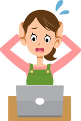 ノートパソンのトラブルに頭を抱えるエプロンをつけた女性
