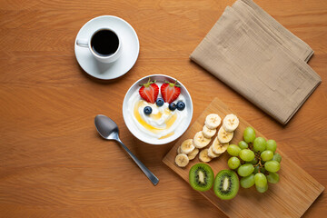 Creative tools and digital graphic design icons arranged on wooden hexagons, symbolizing creativity and technology