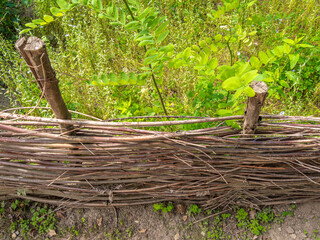 Rustic Woven Wooden Fence in Garden