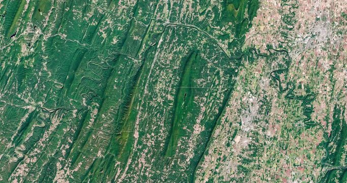 View on green and agricultural zone with meanders of rivers. Camera is zooming out, rotating counterclockwise. Animation based on image by NASA