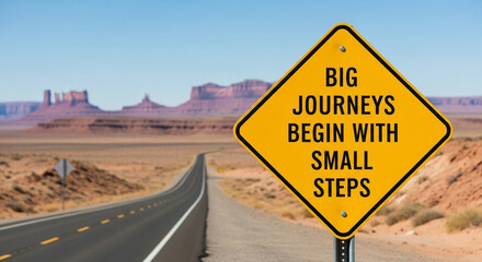 Inspirational road sign big journeys begin with small steps in monument valley