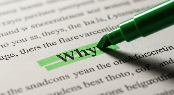 Bright green marker highlighting the word 'Why' on a page of black printed text