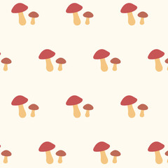 Cute seamless pattern with red mushrooms and beige background