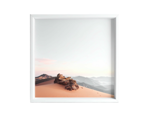 Framed desert landscape sand dune, rocky outcrop, misty mountains, soft sky