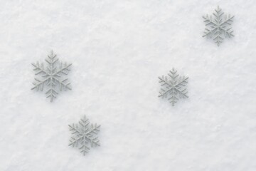 Elegant white snowflakes on a textured snowy winter background.