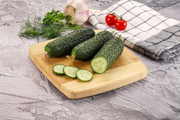 Raw green cucumbers with slices