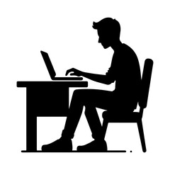 Silhouette of a man working on a laptop at a desk