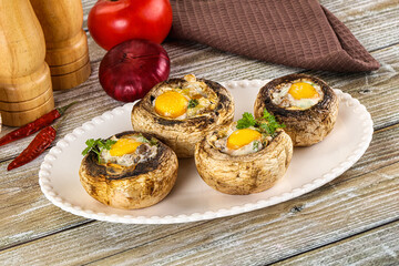 Baked champignon with quail egg