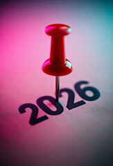Pin Marking the Year 2026 on a Calendar
