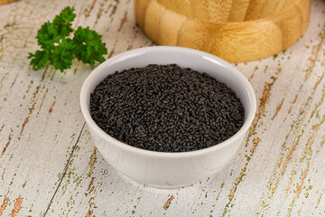 Black dry Nigella seeds in the bowl