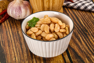 Baked white canned beans in the bowl