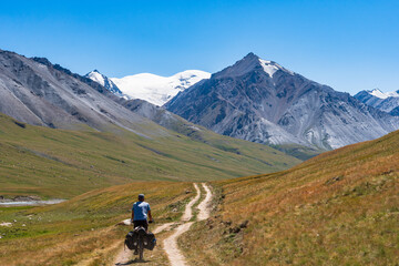 Fototapeta premium Mountain Cyclist, Tian Shan Mountains, Kyrgyzstan