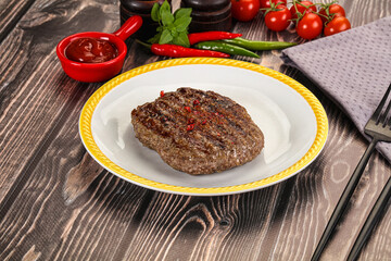 Grilled beef burger cutlet with sauce