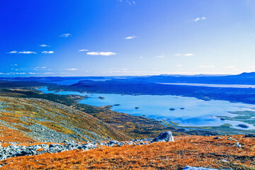Beautiful view of mountainous landscape with lakes and forests in autumn