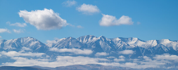 Fototapeta premium The picturesque Trans-Ili Alatau mountain range in the Almaty region of southeastern Kazakhstan on a cloudy autumn morning