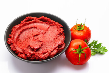 Fresh tomato paste or puree on a white background