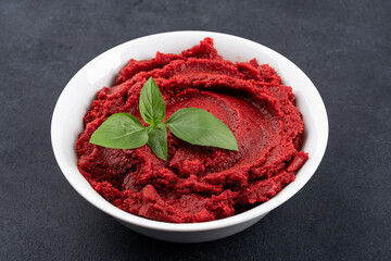 Fresh tomato paste or puree on black  background
