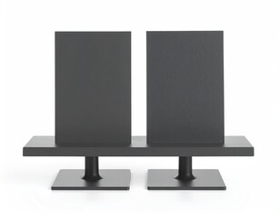 Dual black displays stand on squared pedestals, minimalist