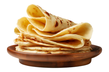 Yemeni malawah flaky buttery bread baked round flatbreads with toasted spots stacked in pile on wooden plate, isolated on white transparent background, concept of traditional bakery