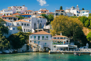 Greece: 9.9.2025: traditional whitewashed houses with terracotta roofs on the hillside of Skiathos...