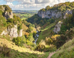 Scenic view of a lush green valley with towering cliffs and a winding river
