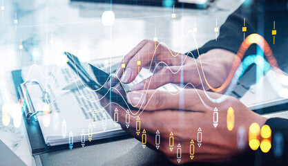 Hands of a person using a tablet with financial documents, overlaid with chart graphics and grid elements in double exposure style on bright background