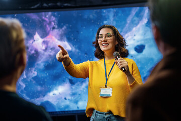 woman is giving a presentation at conference