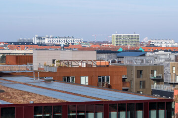 Rooftop view of Copenhagen cityscape with diverse architectural styles reflecting contemporary urban development, sustainable identity and branding space