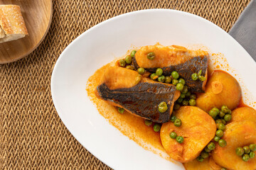 Fish stew with potatoes and green peas