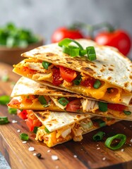 Stacked cheesy filled tortillas with fresh tomatoes, onions, chicken