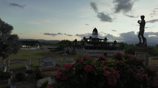 Time lapse at sunset with water and statue, calming yet dramatic scene