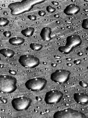 Water droplet texture: A close-up view of water droplets, creating an intricate and detailed texture, reflecting the beauty of simplicity.