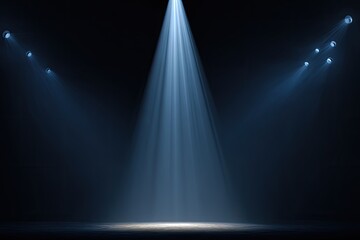 Blue stage spotlights illuminate from different angles, creating drama in a darkened space