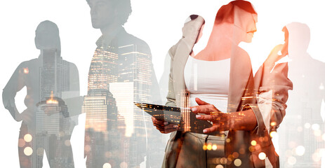 Group of diverse business professionals in formal attire overlaid with city skyline lights, on a...