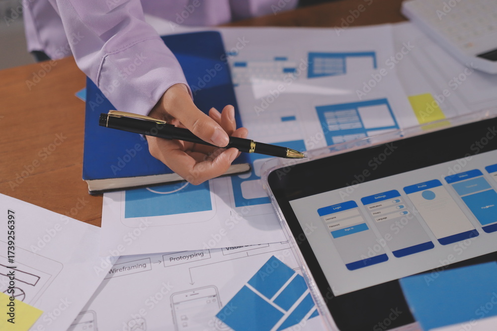 Wall mural close up ux developer and ui designer brainstorming about mobile app interface wireframe design on t
