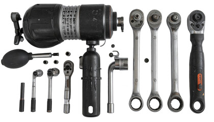 Fototapeta premium Various mechanical tools and components are arranged on a black background, showcasing an array of ratchets, sockets, and a large industrial instrument, emphasizing equipment and elements of...