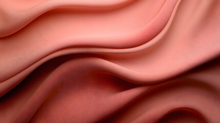 Soft coral fabric drapes elegantly creating flowing texture and warmth
