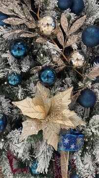 4k footage close up of lighted Christmas tree ornaments and decorations. Mistletoe, baubles, and bell with Interactive sparkling christmas twinkle lights or icicle lights.