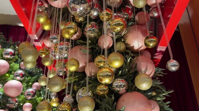 Close up christmas tree decoration from baubles, tinsels, mistletoe, ribbon, snowflakes, and many more.